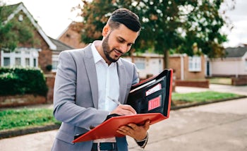 Belvoir Group Agent getting ready for a meeting to showcase the Northwood North West Franchise to a potential franchisee